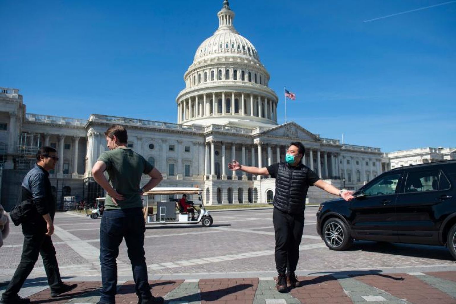  Du khách đeo khẩu trang phòng dịch COVID-19 tại Washington D.C, Mỹ ngày 9/3/2020