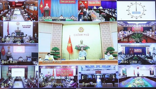 Cuộc họp trực tuyến tại điểm cầu các tỉnh, thành phố trong cả nước. (Ảnh: Dương Giang/TTXVN)